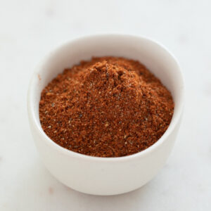 Sqaure photo of a small bowl with homemade Old Bay seasoning.